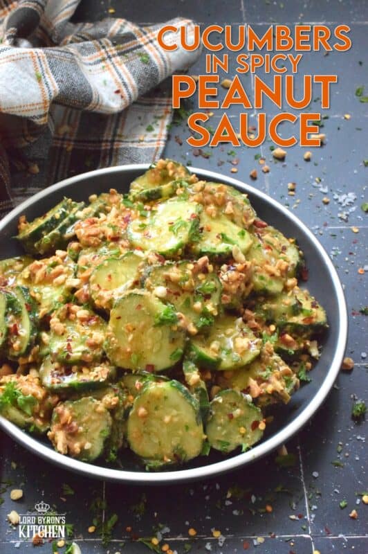 Fresh cucumbers are sliced and tossed in a quick and easy homemade nutty, salty, creamy, spicy, and garlicky sauce.  Toasting the peanuts first and combining them with peanut butter, soy sauce, and rice vinegar makes a delicious cold side, salad, or snack.  Serve at room temperature immediately after preparing for the best results! #cucumber #peanut #peanutbutter #peanutsauce #salad #spicy