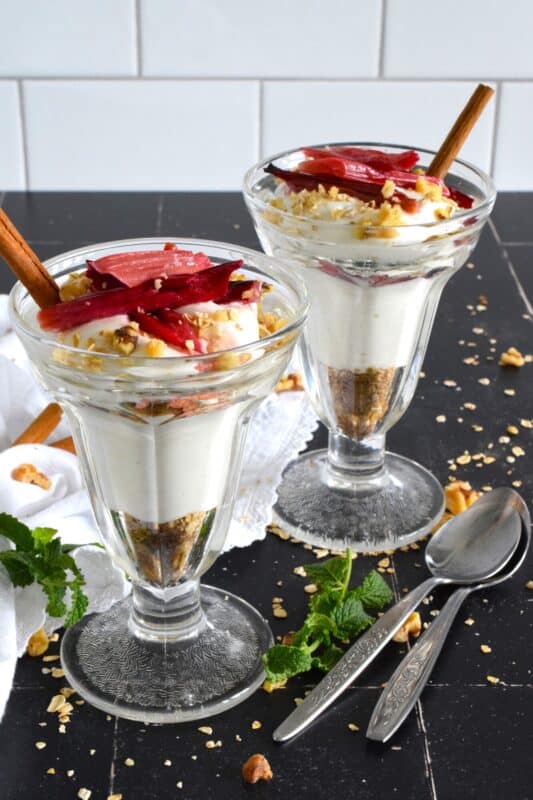 Roasted Rhubarb Parfait is a beautifully presented dessert with exceptional flavour! Easy to prepare, roasted rhubarb is layered with toasted cinnamon walnuts and oats, and vanilla bean yogurt. This simple refreshing summertime dessert is a healthy alternative with just enough guilty indulgence! #rhubarb #parfait #desserts