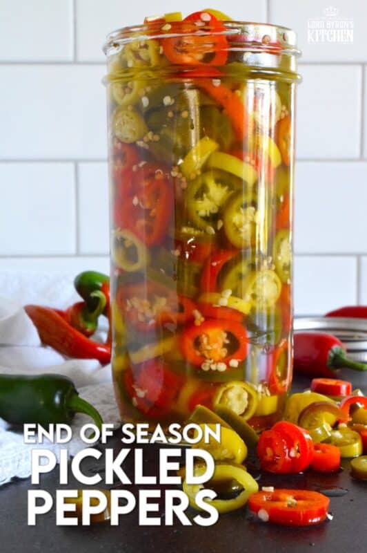 Sadly, summer does come to an end and with it, the last of your hot pepper harvest. When left with a bunch of hot peppers of mixed variety, prepare a big jar of these End of Season Pickled Peppers. No canning is required here! Fashioned with a quick pickle brine, these will keep safely in your refrigerator for two to three months! #pickled #hot #peppers #quick #brine #summer