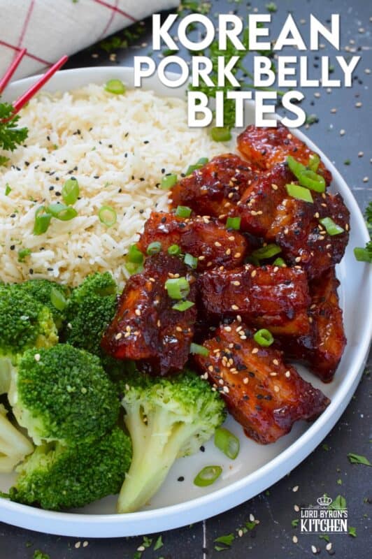 These bite-sized morsels of pork are so quick and easy to prepare! In less than 60 minutes, you can have these delicious Korean Pork Belly Bites on your dinner plate! Prepared with fresh garlic and ginger, and garnished with sliced green onions, expect an explosion of flavour here! #korean #gochujang #porkbelly #pork #oven #asian #sauce