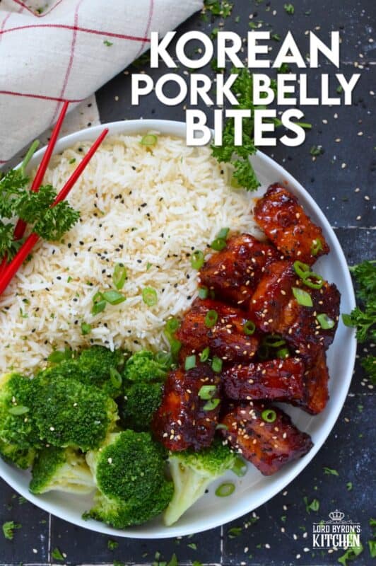 These bite-sized morsels of pork are so quick and easy to prepare! In less than 60 minutes, you can have these delicious Korean Pork Belly Bites on your dinner plate! Prepared with fresh garlic and ginger, and garnished with sliced green onions, expect an explosion of flavour here! #korean #gochujang #porkbelly #pork #oven #asian #sauce