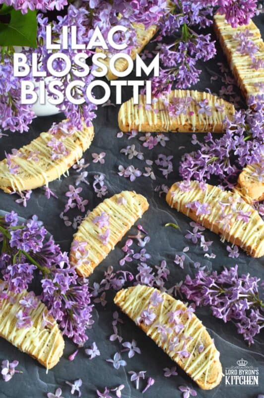 These biscotti are loaded with lilac flavour and scent.  Lilac petals are incorporated into the biscotti dough which has been sweetened with homemade lilac sugar.  Glazed and topped with more lilacs, these Lilac Blossom Biscotti are light, airy, and delicious! Super easy to make, and with their cheerful inclination, no one could resist! Treat yourself to one of these with a hot tea on a lazy Sunday afternoon. #lilac #biscotti #flowers #petals #brunch
