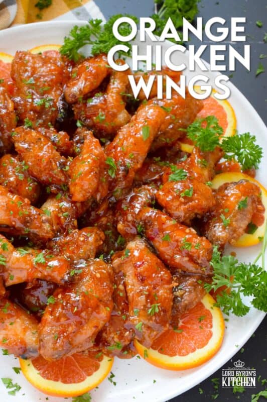 These very sticky wings are prepared with orange marmalade preserves, barbecue sauce, hot sauce, chilies, and seasonings. Orange Chicken Wings are the stickiest and most delicious wings you'll ever eat! They are baked until crispy on the outside and tossed in one of the quickest and easiest sauces! These wings don't need a special occasion; serve these any time you feel like it! #orange #wings #chicken #bbq #sauce #hotsauce
