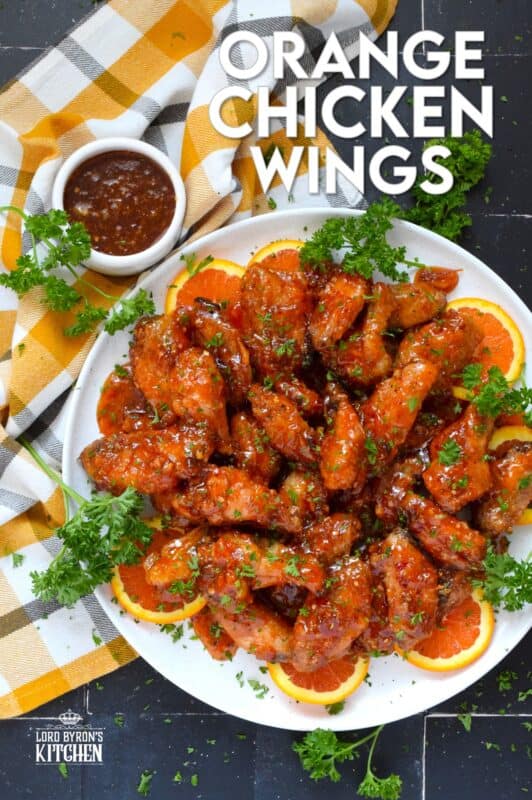 These very sticky wings are prepared with orange marmalade preserves, barbecue sauce, hot sauce, chilies, and seasonings. Orange Chicken Wings are the stickiest and most delicious wings you'll ever eat! They are baked until crispy on the outside and tossed in one of the quickest and easiest sauces! These wings don't need a special occasion; serve these any time you feel like it! #orange #wings #chicken #bbq #sauce #hotsauce