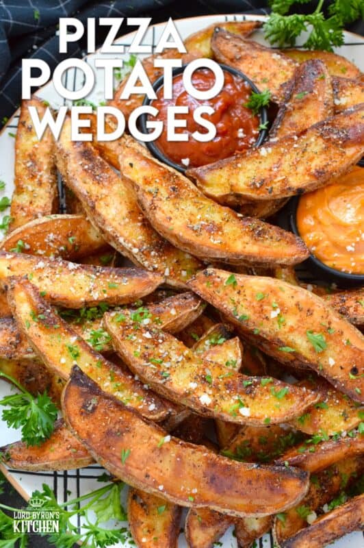 Baked with a light, pillowy center and a crispy crust, Pizza Potato Wedges are seasoned and flavoured with oregano, basil, garlic, onion, and parmesan, making them the perfect pairing with homemade pizza and chicken wings too! #pizza #potato #wedges #sides #seasoned