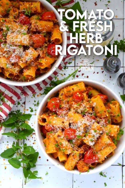 Quick, easy, and delicious describes this Tomato and Fresh Herb Rigatoni! Use fresh cherry tomatoes, thyme and oregano leaves with fresh parsley to make this pasta extra special. The sauce is prepared by blistering the tomatoes in garlic and oil before tossing it with pesto.  Perfect for a weeknight family dinner, this dish takes about 30 minutes from start to finish and you get to dig in and enjoy! #pasta #herbs #fresh #tomato #30minutemeals #familymeals