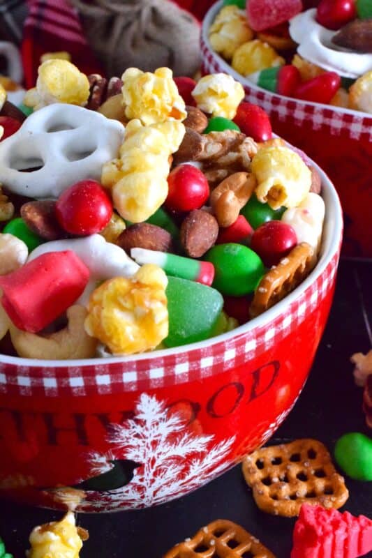 This no-bake, quickly assembled Sweet and Salty Holiday Snack Mix is one of the fastest and easiest gifts you will give this holiday season. Prepared with store-bought, ready-to-eat ingredients, this sweet and salty treat will be enjoyed by all. Gussy up bags or jars and hand them out to your favourite people! #snacks #christmas #popcorn #snackmix #holiday #candy