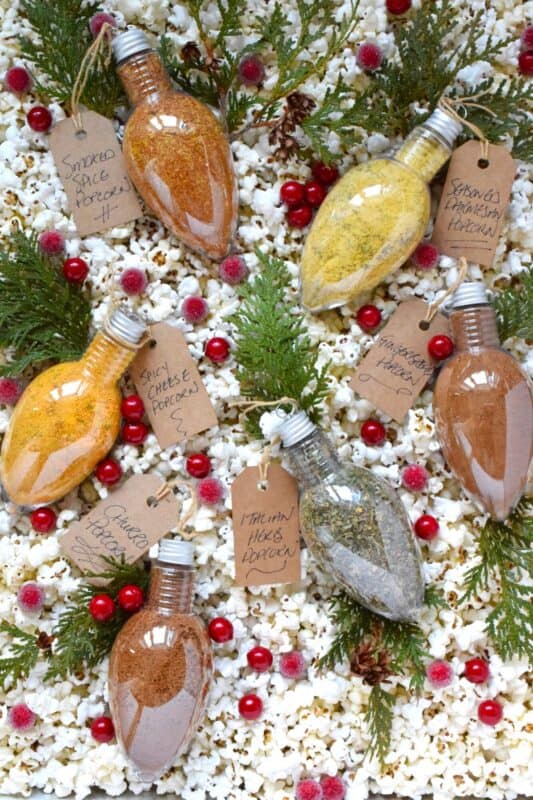 Curling up under a blanket with a bowl of homemade popcorn and a movie on a cold wintery evening is the best way to stay warm and cozy. These giftable Popcorn Seasoning Blends will be put to good use when staying home during a blizzard this winter.  Make it hard to choose by gifting all six flavours! #popcorn #seasoning #blends #snack #gift #giftable #christmas