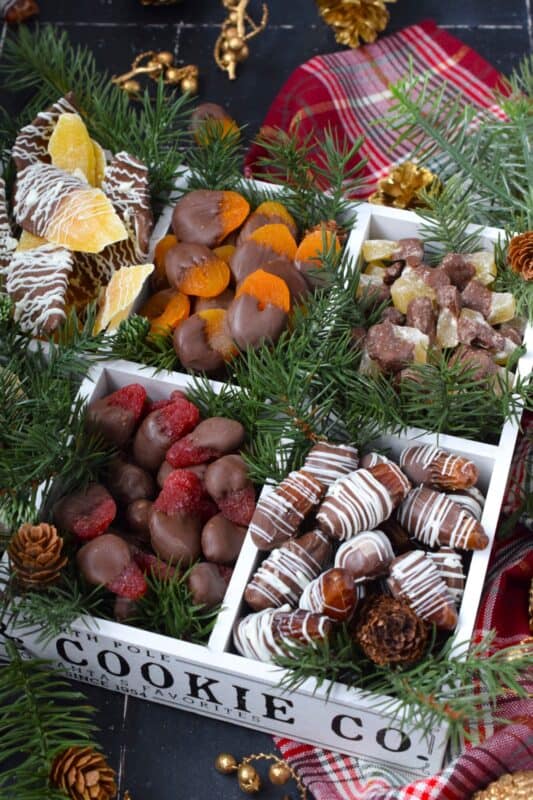 Head out to your favourite baking supply shop and select the dried fruits you like the most. While you're there, pick up some really good melting chocolate too. Once home, you can easily prepare the most delicious and snack-worthy Chocolate Dipped Dried Fruit to gift to your colleagues, friends, family, and neighbours! #gift #christmas #holiday #nobake #chocolate #dried #fruit