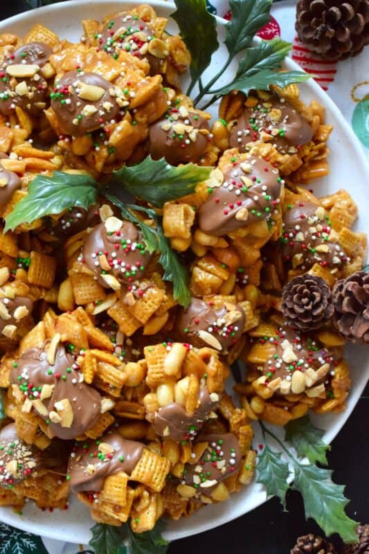 Everyone loves a no-bake treat and this one is just perfect! Peanut and Butterscotch Chex Scotcheroos are prepared with peanut butter, butterscotch baking chips, and milk chocolate as well! Top these treats with chopped salted peanuts and sprinkles for added texture, flavour, and whimsy! #scotcheroos #chex #butterscotch #peanutbutter #nobake
