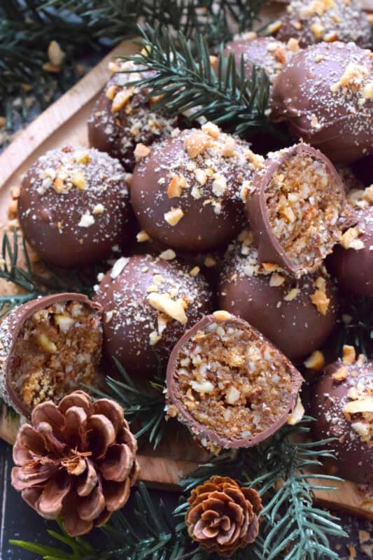 Phenomenal is the only word to describe these No Bake Pecan Pie Truffles! In just a few minutes, the filling is easily prepared and can be made in advance. Roll the filling into balls and dip them into silky smooth melted milk chocolate. Top these truffles with more chopped pecans and enjoy! #pecan #balls #truffles #holiday #chocolate #nobake