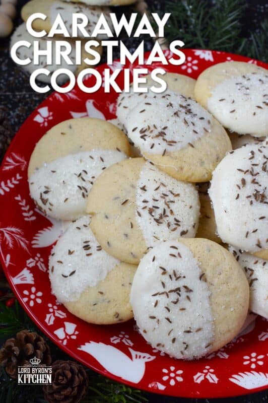 These tender, soft, and moist Caraway Christmas Cookies are prepared with a basic vanilla and caraway seed-flavoured cookie dough. Dipped in melted white chocolate and sprinkled with coarse sanding sugar and more caraway, these cookies are a great addition to any holiday cookie exchange or cookie platter! #caraway #cookies #chocolate #christmas