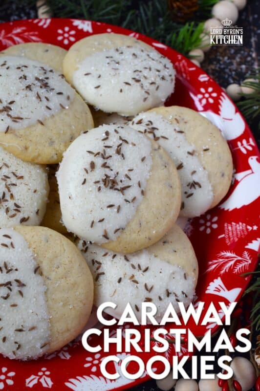 These tender, soft, and moist Caraway Christmas Cookies are prepared with a basic vanilla and caraway seed-flavoured cookie dough. Dipped in melted white chocolate and sprinkled with coarse sanding sugar and more caraway, these cookies are a great addition to any holiday cookie exchange or cookie platter! #caraway #cookies #chocolate #christmas