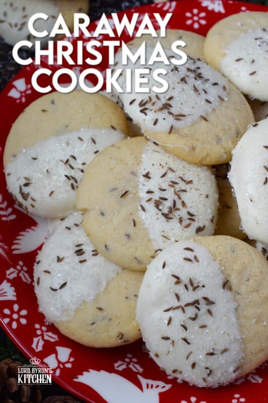 These tender, soft, and moist Caraway Christmas Cookies are prepared with a basic vanilla and caraway seed-flavoured cookie dough. Dipped in melted white chocolate and sprinkled with coarse sanding sugar and more caraway, these cookies are a great addition to any holiday cookie exchange or cookie platter! #caraway #cookies #chocolate #christmas
