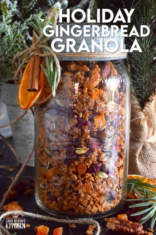 Almonds, cashews, pecans, pumpkin seeds, cranberries, and apricots help to flavour and bulk up this Holiday Gingerbread Granola. Baked with maple syrup and butter, and seasoned with cinnamon, nutmeg, and allspice, this healthy snack makes a very delicious giftable treat! #granola #homemade #gift #gingerbread