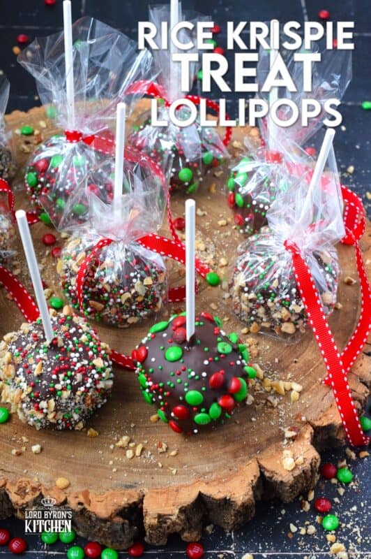 These cute little treats are so easy to make and just in time for Christmas! Rice Krispie Treat Lollipops are a no-bake treat with so many decorating options! Dip the balls in chocolate and let your imagination go wild with candy, sprinkles, nuts, etc.  Wrap and give these kids both young and old! #ricekrispie #treats #nobake #lollipop