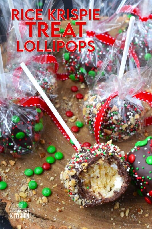 These cute little treats are so easy to make and just in time for Christmas! Rice Krispie Treat Lollipops are a no-bake treat with so many decorating options! Dip the balls in chocolate and let your imagination go wild with candy, sprinkles, nuts, etc.  Wrap and give these kids both young and old! #ricekrispie #treats #nobake #lollipop