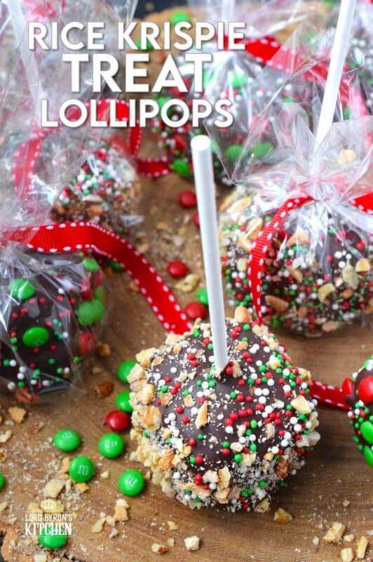 These cute little treats are so easy to make and just in time for Christmas! Rice Krispie Treat Lollipops are a no-bake treat with so many decorating options! Dip the balls in chocolate and let your imagination go wild with candy, sprinkles, nuts, etc.  Wrap and give these kids both young and old! #ricekrispie #treats #nobake #lollipop
