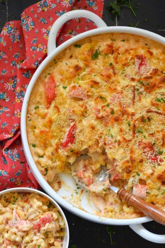By adding lobster meat and seafood seasoning to regular mac and cheese, it is transformed into one of the most delicious and comforting meals. This version of Lobster Macaroni and Cheese starts with an easy bechamel and ends with a crunchy panko crust. It just cannot be beat! #lobster #seafood #macandcheese #macaroni #baked