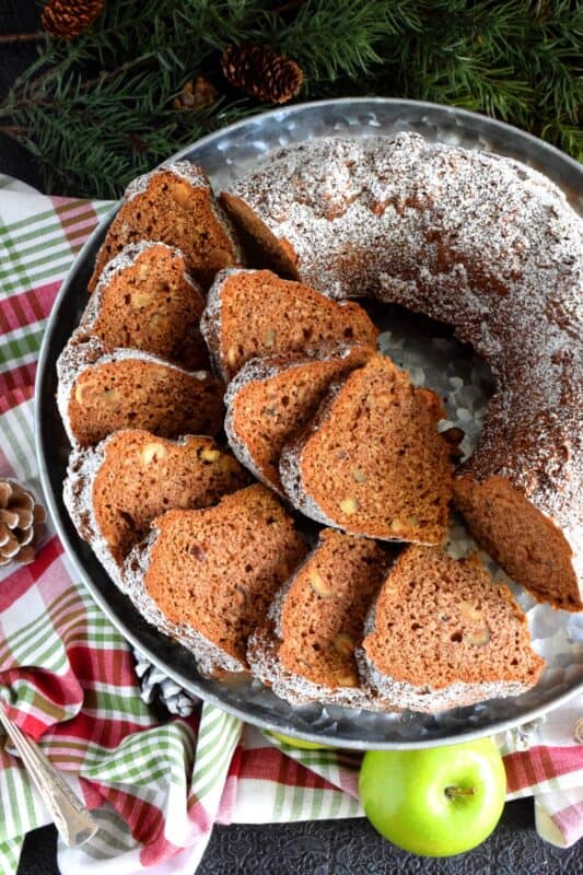 Apples and pecans, combined with holiday spices, make this Holiday Apple Spiced Bundt Cake perfectly rich and moist! With a cake this delicious, frosting and fancy decoration is not needed! #spiced #apple #bundt #pecans