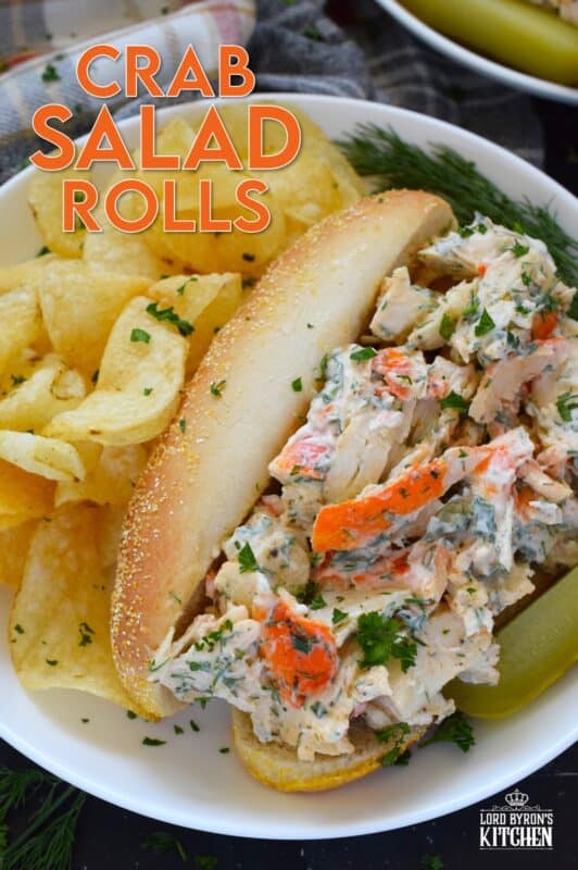 Loaded with crab meat, these Crab Salad Rolls are a fast and easy meal that is easily completed with a handful of really crispy kettle chips! The crab meat is tossed in a savoury thick dressing made with mayonnaise, chives, dill, lemon, and celery. It really does not get any easier or any more delicious than this! #crab #imitation #salad #sandwich #rolls