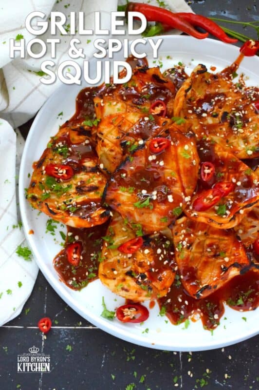 Any excuse to grill is a good excuse! This recipe makes use of a homemade sauce consisting of garlic, ginger, soy sauce, red chilies, and hot sauce. Grilled Hot and Spicy Squid is quick and easy; the squid is super tender with a few char marks. Use freshly prepared squid or frozen squid tubes here! #squid #grilled #hot #spicy #calamari #tubes