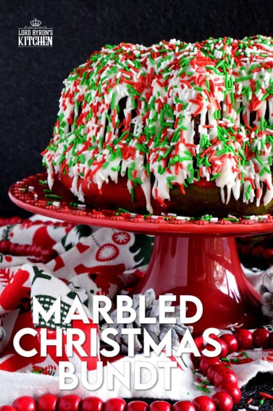 Kids of all ages will love a big slice of this Marbled Christmas Bundt Cake. This cake is festive, colourful, merry, and bright! It's made with yogurt so it will stay beautifully soft and moist. And, no matter what your age, everyone loves sprinkles! #bundt #sprinkles #marble #christmas #cake