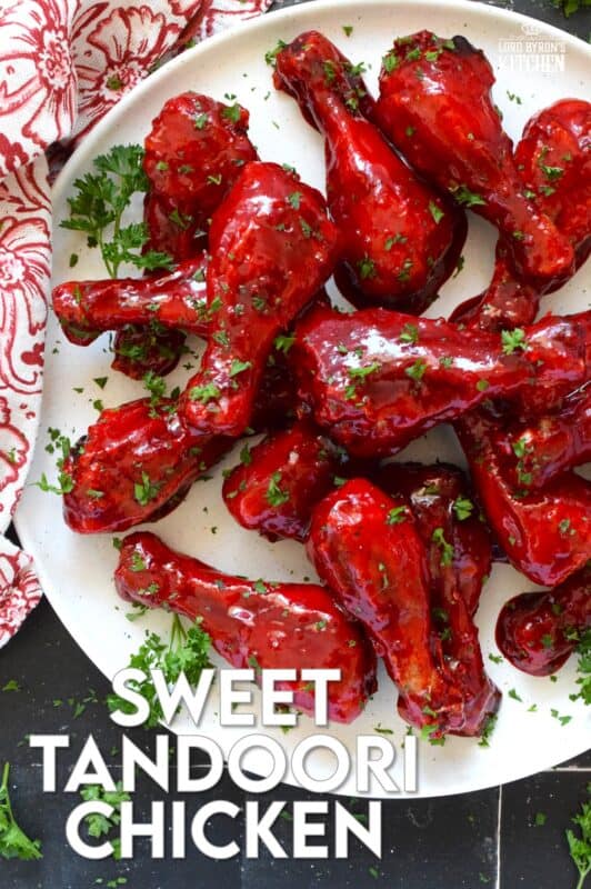 Spicy and flavourful with a slightly smoky taste, this Sweet Tandoori Chicken is mouthwateringly delightful! Tossed in cornstarch and baked in a hot oven, these chicken drumsticks are baked until crisp and then drenched in a sweet and sticky garlicky sauce that takes just minutes to prepare! #tandoori #spicy #chicken #drumsticks #baked