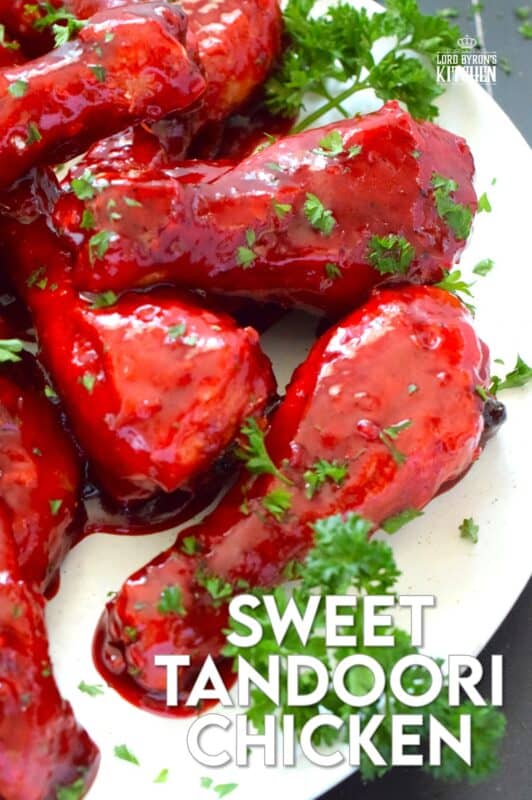 Spicy and flavourful with a slightly smoky taste, this Sweet Tandoori Chicken is mouthwateringly delightful! Tossed in cornstarch and baked in a hot oven, these chicken drumsticks are baked until crisp and then drenched in a sweet and sticky garlicky sauce that takes just minutes to prepare! #tandoori #spicy #chicken #drumsticks #baked