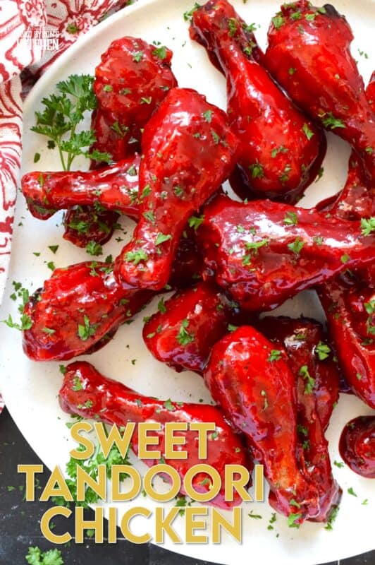 Spicy and flavourful with a slightly smoky taste, this Sweet Tandoori Chicken is mouthwateringly delightful! Tossed in cornstarch and baked in a hot oven, these chicken drumsticks are baked until crisp and then drenched in a sweet and sticky garlicky sauce that takes just minutes to prepare! #tandoori #spicy #chicken #drumsticks #baked