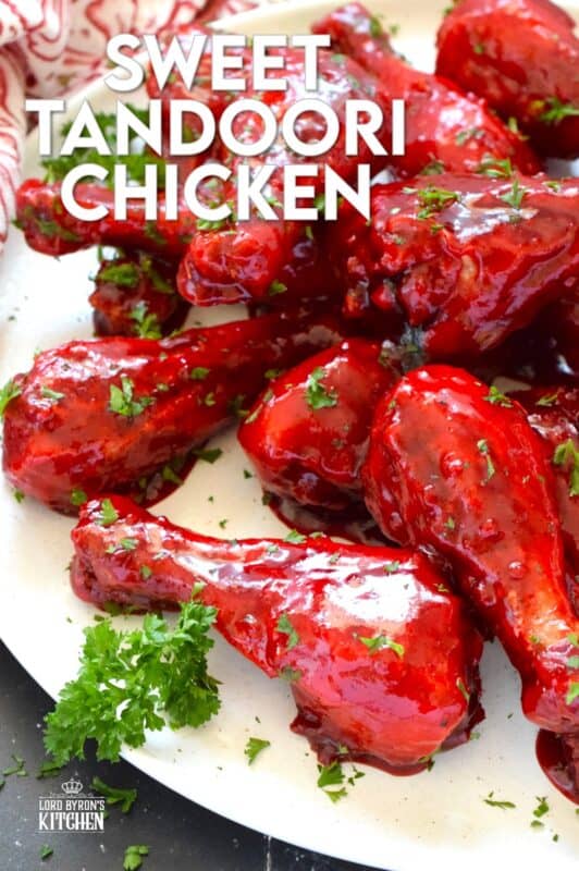 Spicy and flavourful with a slightly smoky taste, this Sweet Tandoori Chicken is mouthwateringly delightful! Tossed in cornstarch and baked in a hot oven, these chicken drumsticks are baked until crisp and then drenched in a sweet and sticky garlicky sauce that takes just minutes to prepare! #tandoori #spicy #chicken #drumsticks #baked