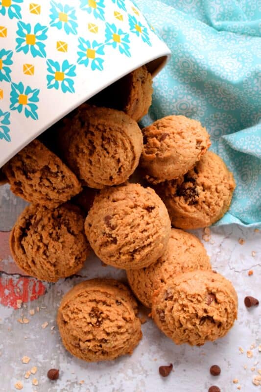 Peanut Butter Chocolate Chip Oatmeal Raisin Cookies are large and puffy, soft and chewy, and can easily be a delicious substitute for just about any store-bought granola bar! These cookies have everything you need to get you going - oats, peanut butter, raisins, and chocolate chips! #oatmeal #raisin #cookies #peanutbutter