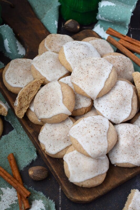 Glazed Chai Spiced Shortbread Cookies are buttery, light, and airy. The cookies are infused with familiar chai spices like cinnamon, nutmeg, ginger, cloves, and cardamom. Once cooled, the cookies are flooded with a delightfully smooth and sweet glaze; these cookies are bound to be a holiday favourite! #chai #cookies #cardamom #glazed #christmas