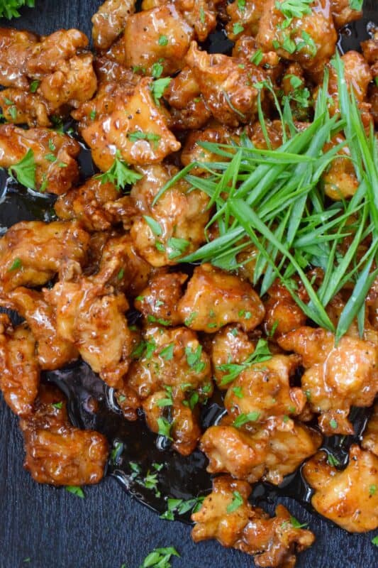 Any recipe prepared with butter has the potential to be quite delicious and in the case of this Honey Butter Chicken, that statement stands true! The combination of honey and butter in the sauce creates a thick and shiny glaze that coats and sticks to the crispy fried chicken. This is one quick and easy chicken recipe you do not want to miss out on! #honey #butter #chicken #fried