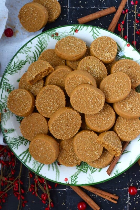 With a slightly crispy outer edge and a chewy center, Cinnamon Ginger Cookies are topped with a sprinkling of caramelly turbinado sugar. These cookies are warming to the taste because of the mild heat produced by the cinnamon and ginger. Serve these with hot tea or coffee for a delightful little treat! #molasses #cinnamon #ginger #cookies