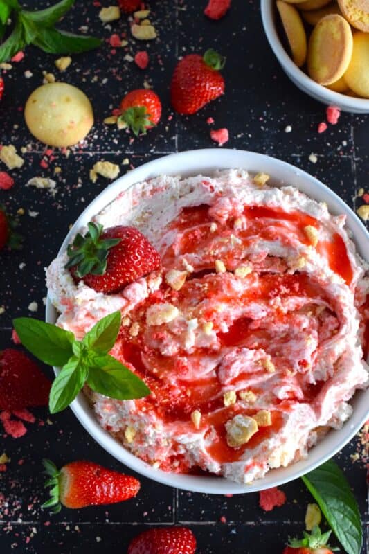 Strawberry Shortcake Dessert Dip is creamy, thick, and does not deflate like whipped cream because it's made with mascarpone! It's sweet, slightly tart, and made with strawberry shortcake crumbs! #strawberry #shortcake #crumbs #dessert #dip #mascarpone