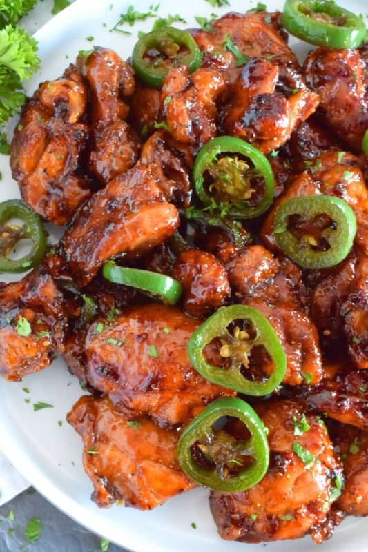 Spicy Jalapeno Chicken is a crispy fried chicken in a thick, sweet, savoury, and spicy sauce; this recipe is most certainly for the spicy food lover. Prepared with a light and crispy coating, this chicken can be as spicy or as mild as you like - it's really up to your personal preference! #friedchicken #jalapeno #jalapenochicken #spicychicken #chicken