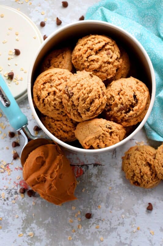 Peanut Butter Chocolate Chip Oatmeal Raisin Cookies are large and puffy, soft and chewy, and can easily be a delicious substitute for just about any store-bought granola bar! These cookies have everything you need to get you going - oats, peanut butter, raisins, and chocolate chips! #oatmeal #raisin #cookies #peanutbutter
