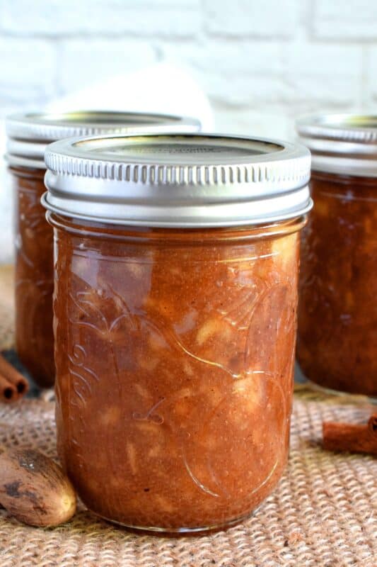 The taste of autumn captured and preserved in a simple to prepare jam. Apple Cinnamon Jam is a jam that tastes like a dessert. Great on ice cream, or folded into apple turnovers, or just smeared liberally on warm toast! #apple #jam #butter #cinnamon