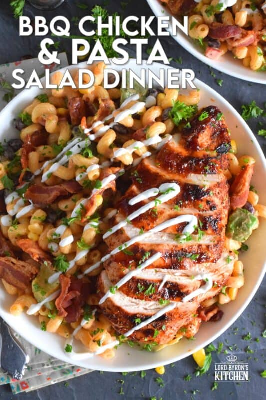 Spice-seasoned chicken breasts are grilled to perfection and then brushed with BBQ sauce and served with a delicious pasta salad prepared with bacon, avocado, corn, black beans, green onions, and roasted red peppers.  This pasta salad dinner is a hearty meal great for any backyard family picnic! #bbq #chicken #pasta #salad #dinner