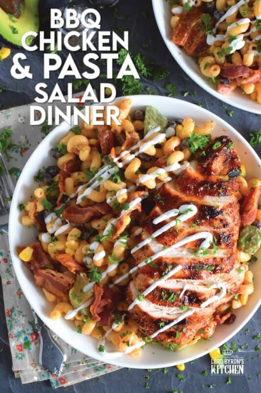 Spice-seasoned chicken breasts are grilled to perfection and then brushed with BBQ sauce and served with a delicious pasta salad prepared with bacon, avocado, corn, black beans, green onions, and roasted red peppers.  This pasta salad dinner is a hearty meal great for any backyard family picnic! #bbq #chicken #pasta #salad #dinner