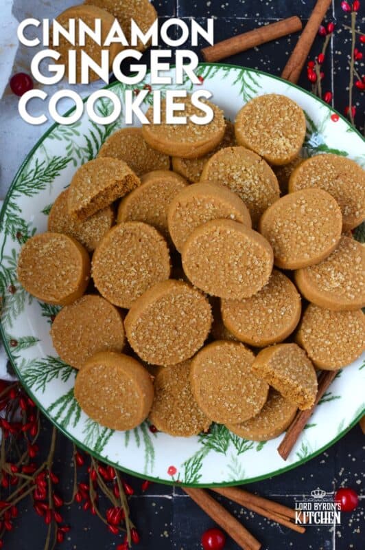 With a slightly crispy outer edge and a chewy center, Cinnamon Ginger Cookies are topped with a sprinkling of caramelly turbinado sugar. These cookies are warming to the taste because of the mild heat produced by the cinnamon and ginger. Serve these with hot tea or coffee for a delightful little treat! #molasses #cinnamon #ginger #cookies