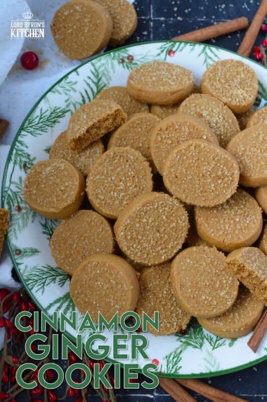 With a slightly crispy outer edge and a chewy center, Cinnamon Ginger Cookies are topped with a sprinkling of caramelly turbinado sugar. These cookies are warming to the taste because of the mild heat produced by the cinnamon and ginger. Serve these with hot tea or coffee for a delightful little treat! #molasses #cinnamon #ginger #cookies
