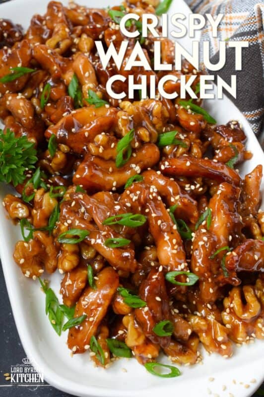 Quite a popular dish at almost every North American Chinese buffet, Crispy Walnut Chicken is prepared with moist and tender boneless and skinless chicken thighs. The chicken is coated and fried until crispy then tossed in a sweet sauce made with honey, soy, sesame, and of course, walnuts! #friedchicken #chicken #sweet #soy #walnut