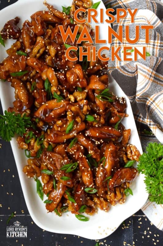 Quite a popular dish at almost every North American Chinese buffet, Crispy Walnut Chicken is prepared with moist and tender boneless and skinless chicken thighs. The chicken is coated and fried until crispy then tossed in a sweet sauce made with honey, soy, sesame, and of course, walnuts! #friedchicken #chicken #sweet #soy #walnut