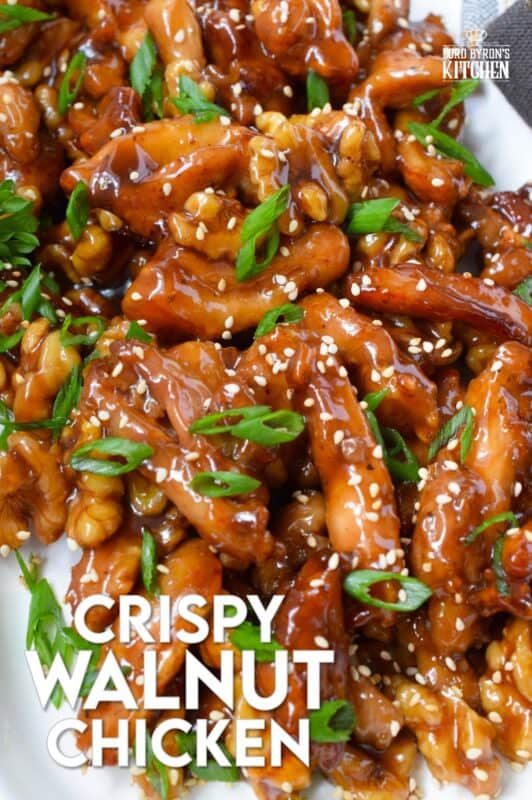 Quite a popular dish at almost every North American Chinese buffet, Crispy Walnut Chicken is prepared with moist and tender boneless and skinless chicken thighs. The chicken is coated and fried until crispy then tossed in a sweet sauce made with honey, soy, sesame, and of course, walnuts! #friedchicken #chicken #sweet #soy #walnut