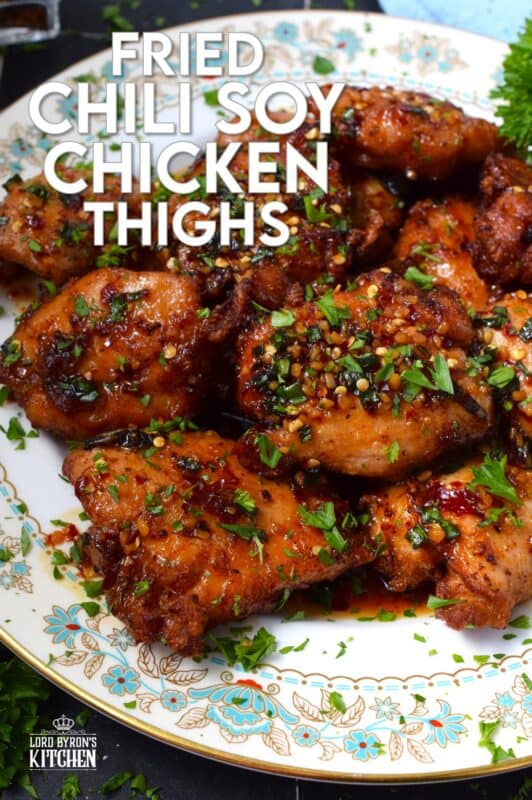 Moist and tender, Fried Chili Soy Chicken Thighs are marinated and pan-fried until crispy and drizzled with a homemade chili sauce easily prepared with brown sugar, chilies, vinegar, and sesame oil. #chicken #asian #fried #spicy #thighs