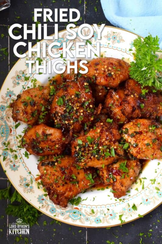 Moist and tender, Fried Chili Soy Chicken Thighs are marinated and pan-fried until crispy and drizzled with a homemade chili sauce easily prepared with brown sugar, chilies, vinegar, and sesame oil. #chicken #asian #fried #spicy #thighs