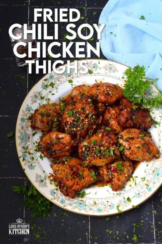 Moist and tender, Fried Chili Soy Chicken Thighs are marinated and pan-fried until crispy and drizzled with a homemade chili sauce easily prepared with brown sugar, chilies, vinegar, and sesame oil. #chicken #asian #fried #spicy #thighs