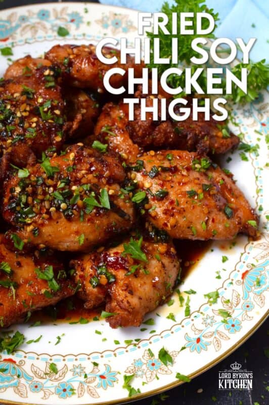 Moist and tender, Fried Chili Soy Chicken Thighs are marinated and pan-fried until crispy and drizzled with a homemade chili sauce easily prepared with brown sugar, chilies, vinegar, and sesame oil. #chicken #asian #fried #spicy #thighs